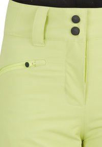 Lime-green trousers with a smooth texture, featuring a high waist, two black buttons, and a zippered pocket on the left side.