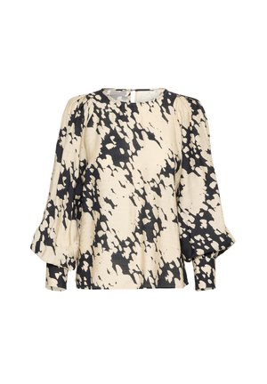Blouse ample crème avec un imprimé abstrait noir. Dotée de manches longues bouffantes et d'un décolleté rond. Tissu texturé avec un léger éclat.