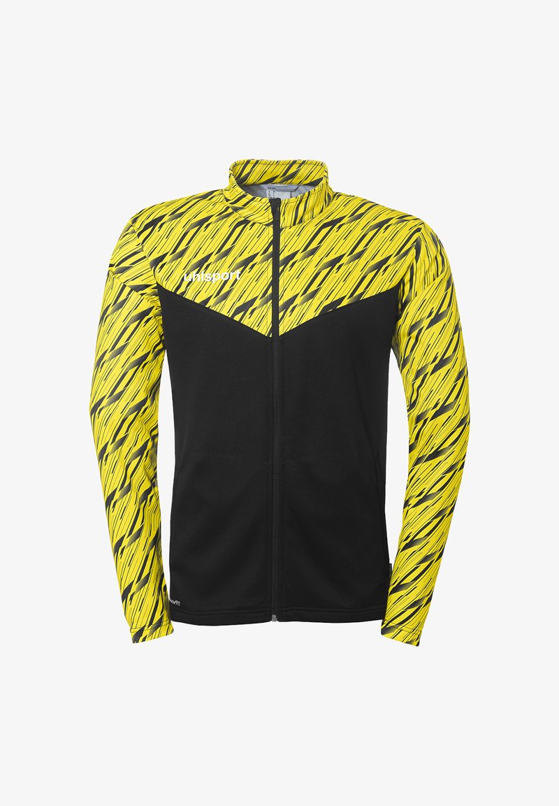 Zwarte en gele sportjack met een geometrisch patroon, ritssluiting aan de voorkant, staande kraag en lange mouwen. Het materiaal lijkt lichtgewicht en flexibel te zijn.