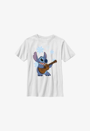 Hvid T-shirt med en blå tegneserie-aliensfigur, der spiller på en brun guitar, omgivet af lyseblå blomstermønstre.