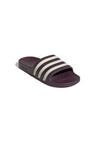 Sandale slide violet foncé avec trois bandes blanches sur la bride supérieure, bout ouvert et semelle moulurée.