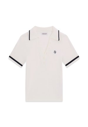 Weißes Polohemd mit kurzen Ärmeln, schwarzer Besatz am Kragen und an den Ärmelsäumen, kleines schwarzes gesticktes Logo auf der linken Brust.