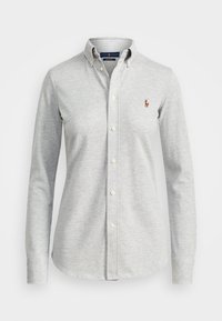 Grå långärmad knapplik skjorta i bomull, med klassisk krage och en liten polo-logotyp på vänster bröst.