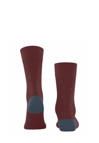 Chaussettes bordeaux avec des pois bleus et des zones de talon et de orteil renforcées en bleu, présentées de face et de dos.