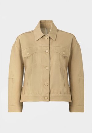Veste en denim beige avec un col, fermeture par boutons à l'avant et deux poches poitrine. Présente une coupe structurée et des manches longues.