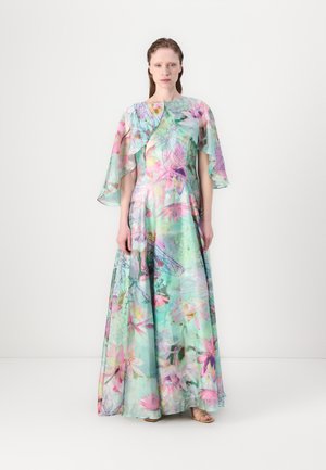 Long, flowing dress in sheer fabric featuring a vibrant floral design in shades of blue, pink, and green. Ruffled sleeves add movement.