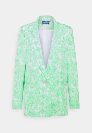 White blazer with a single button, green floral print, notch lapels, long sleeves, and a slim fit hanging on a plain background.