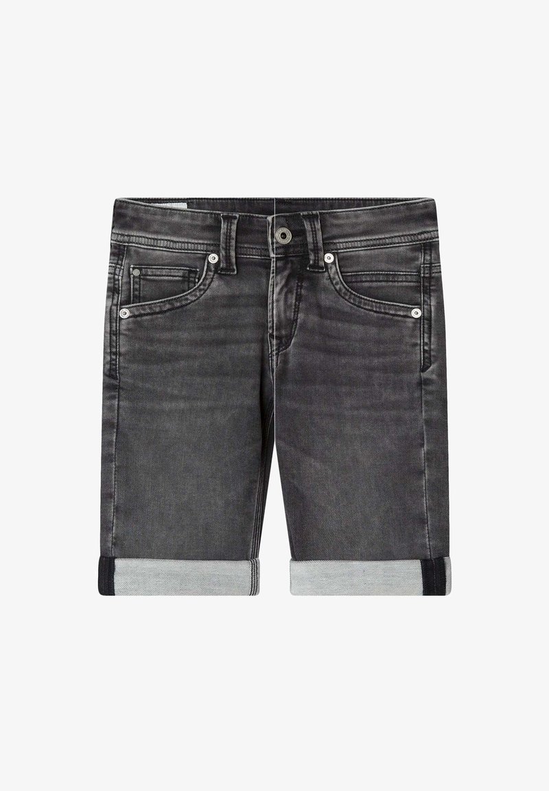 Tamne traperice u tamno sivoj boji s prevrnutim manžetama. Ima pet džepova, smeđe šavove i metalno zatvaranje na dugme. Glatka tekstura.