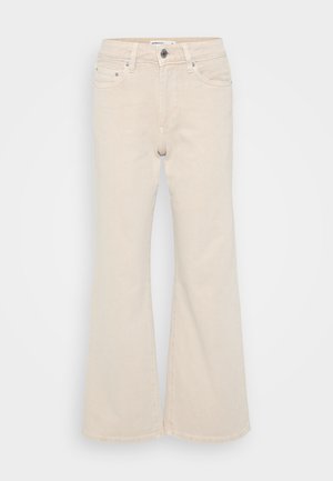 Beige wijd-zitende jeans van denim, met een knoop- en ritsluiting, vijf zakken en subtiele stikseldetails.
