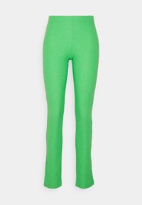 Leggings verdes com acabamento canelado, de design ajustado e ligeira flare nos tornozelos. Apresentam um tecido elástico para maior conforto.