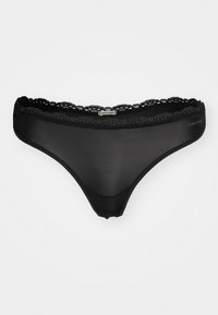 Black thong lingerie made of sheer fabric with a delicate lace trim, featuring an elasticated waistband and a logo accent on the side.