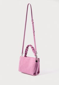 Pink suede handbag with braided short handle and adjustable long strap, rectangular shape with silver-tone hardware, positioned upright.