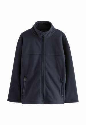 Giacca in pile di un blu navy scuro con colletto alto, zip frontale completa e due tasche laterali con zip. Texture liscia e vestibilità rilassata.