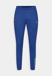 Pantalones deportivos azules con una cinturilla elástica, que presentan un parche de logo negro y el texto en blanco "PARIS" en el lado. Textura suave.