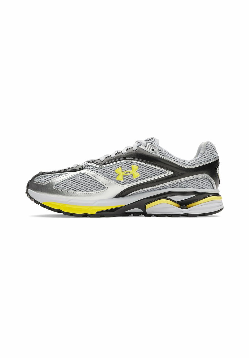 Sport shoe with a gray mesh upper, black and silver accents, yellow midsole detailing, and a sleek profile. Lightweight design with laces.