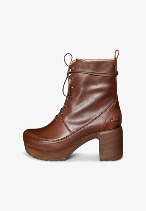 Brown leather ankle boot with a rounded toe, lace-up front, and chunky wooden heel. Notable stitching and embossed logo detail on the side.