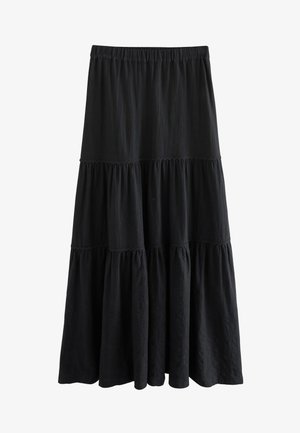 Zwarte gelaagde rok gemaakt van gestructureerde stof. Heeft een elastische tailleband en geplooide lagen, wat zorgt voor een vloeiend silhouet.