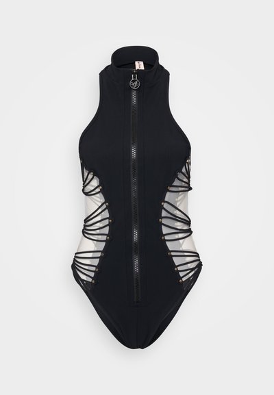 Black swimsuit with high collar and front zipper. Features sheer side panels with crisscross straps and decorative studs.