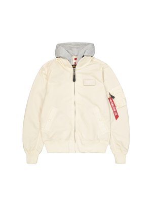 Krēms bomber jaka ar pelēku kapuci, ar rāvējslēdzēju, ribotiem piedurkņu galiem un divām priekšējām kabatām. Iekļauta arī sānu rāvējslēdzēja kabata un sarkans uzlīmju elements.