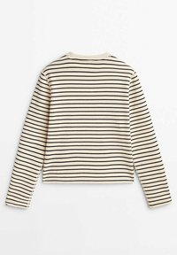 Maglietta a maniche lunghe, con colletto rotondo, di colore crema con sottili righe nere. Presenta una vestibilità ampia, un colletto ribattuto e polsini senza cuciture.