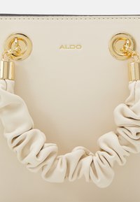 ALDO BILITHA mleczny