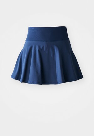 Mornarsko modra razširjena krila, izdelana iz mehkega, elastičnega materiala. Ima širok, gladek pas in nabran dizajn za dodatno gibljivost.