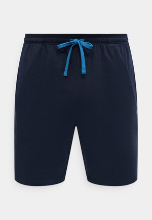 Tmavomodré bežné šortky s elastickým pásom a jasne modrým sťahovacím šnúrkou vpredu, zobrazené na jednoduchom bielom pozadí.