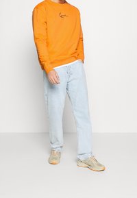 Karl Kani Sudadera - orange