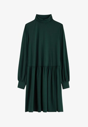 Tamnozelena haljina dugih rukava s visokim ovratnikom, naboranim strukom i lepršavom suknjom. Izrađena je od glatkog, rastezljivog materijala.