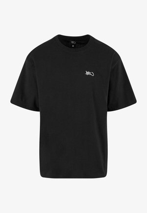 T-shirt in cotone nero con maniche corte, scollo rotondo e logo bianco sul lato sinistro del petto. Vestibilità classica con una texture liscia.