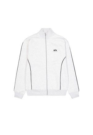 Helehallist tõmblukuga jakk kõrge kraega, mustade külgtriipudega ja väikese logoga rinnal. Valmistatud pehmest, tekstuuritud kangast.