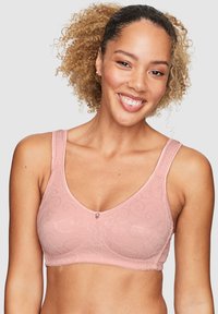 Rosa spetsbralette med en slät yta, delikat svirkningsmönster och en liten mittenknapp. Breda band för komfort och stöd.