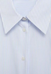 Light blue and white striped dress shirt with a pointed collar, featuring a button closure and a smooth, soft fabric texture.