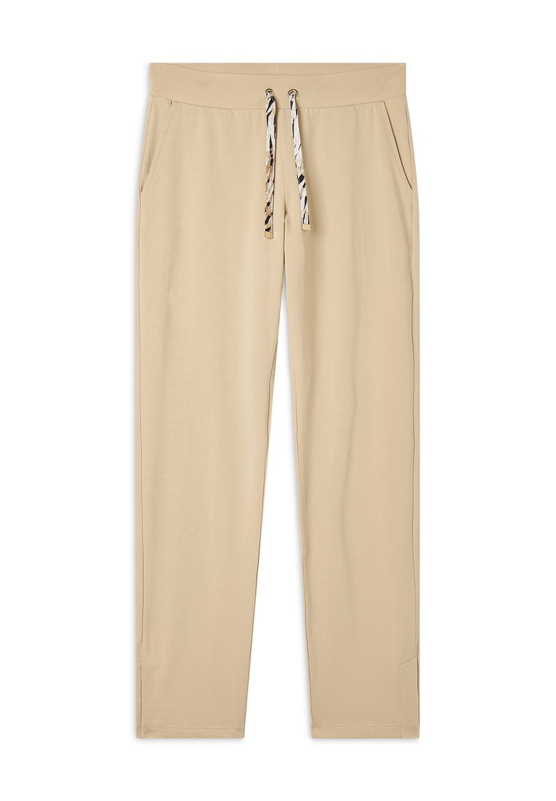 Pantalones jogger beige hechos de tela suave, con cintura ajustable y detalles de estampado animal, y bolsillos laterales para mayor comodidad.
