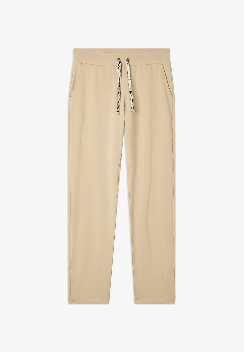 Pantalones jogger beige hechos de tela suave, con cintura ajustable y detalles de estampado animal, y bolsillos laterales para mayor comodidad.