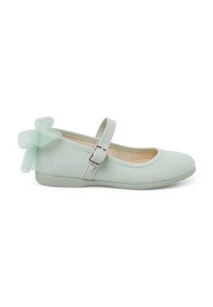 Mint green Mary Jane flats with woven texture, adjustable strap, and a tulle bow accent on the heel. Rounded toe and flat sole.