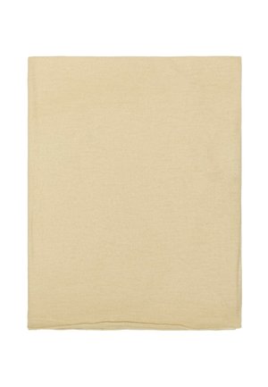 Morceau de tissu carré beige avec une surface douce, légèrement texturée, et des bords soigneusement finis.