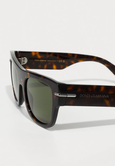 Tortoiseshell sunglasses with dark green lenses, rectangular frame, silver hardware accents, and etched brand name on the temples.