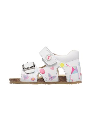 White children's sandal with buckle and Velcro straps, decorated with colorful butterflies, balloons, flowers, sun, hearts, and a kite design.