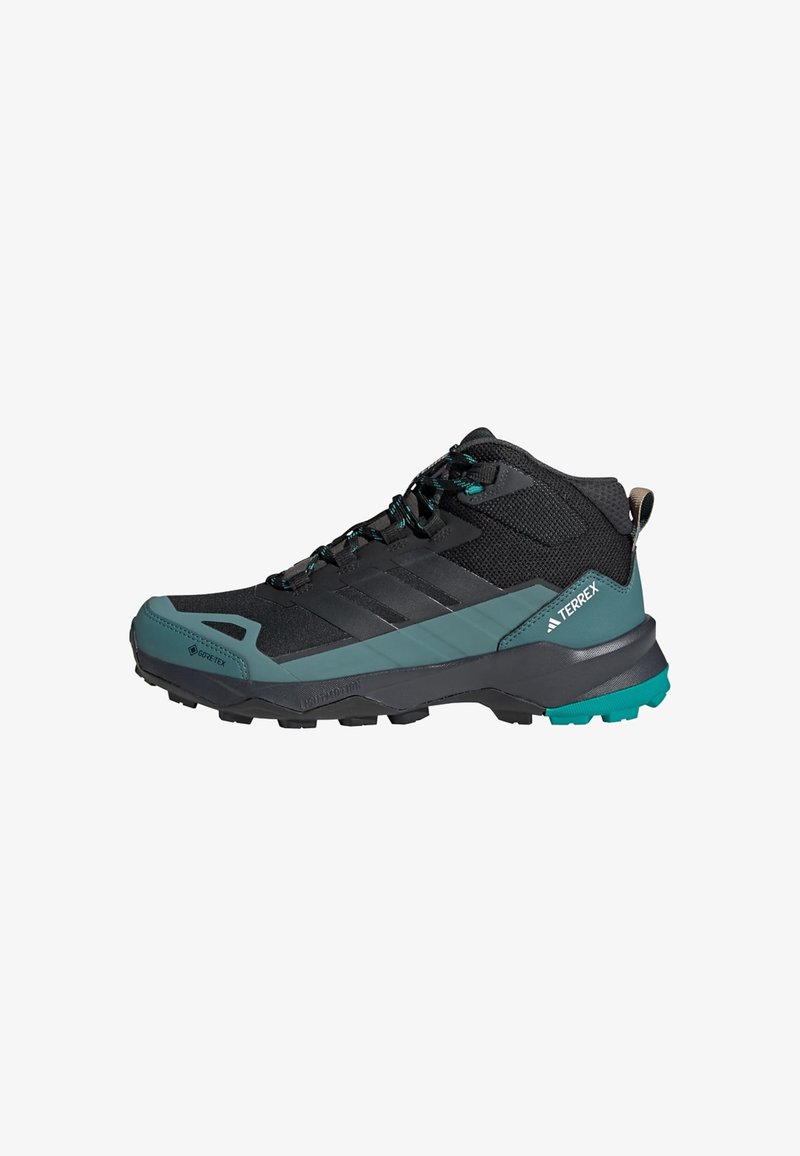 Crne i tirkizne planinarske cipele s teksturiranim gornjim dijelom, ojačanim prstom i robusnom gumom za prianjanje. Sadrži GORE-TEX oznaku.