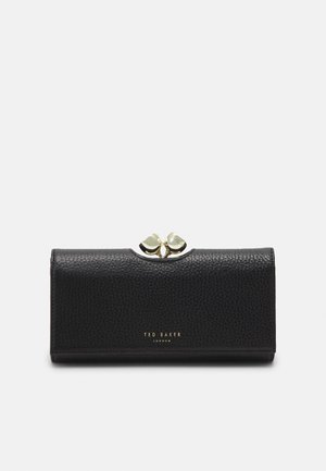 Portefeuille en cuir noir texturé avec un fermoir doré en forme de deux cœurs et un petit logo doré Ted Baker London à l'avant.