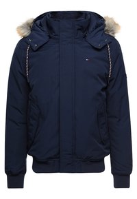 Mörkblå vinterjacka med huva med pälsdetalj, randiga dragsnören, dragkedja fram, ribbade ärmslut och sidofickor.