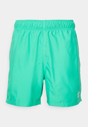 Grønne badeshorts lavet af let, skinnende materiale. Har en elastisk linning og en lille hvid logo på den nederste side.