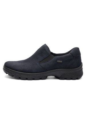 Men’s black slip-on shoe with suede upper, elastic side panels, rugged sole, and Gore-Tex waterproof tag on the side.