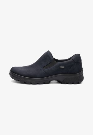 Men’s black slip-on shoe with suede upper, elastic side panels, rugged sole, and Gore-Tex waterproof tag on the side.