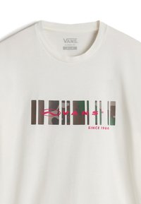 White cotton t-shirt featuring a graphic design with vertical multi-colored bars and the text "VANS" in pink, along with "SINCE 1966" below.