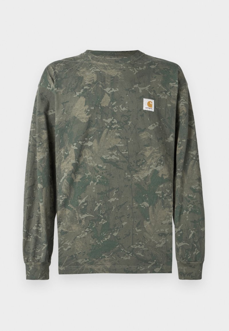 Long-sleeve camouflage shirt in green and brown tones with a small square Carhartt logo patch on the left chest.
