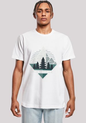 White cotton t-shirt featuring a geometric mountain and tree graphic in green and gray, with text "HIKE MORE" at the bottom.