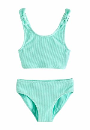 Light blue textured fabric bikini set with knotted shoulder straps on the top and high-cut bottoms, displayed flat on white background.