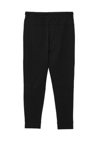 Schwarze Leggings aus weichem Stoff mit elastischem Taillenbund, schmal zulaufendem Bein und Nahtdetails für einen eleganten Look.